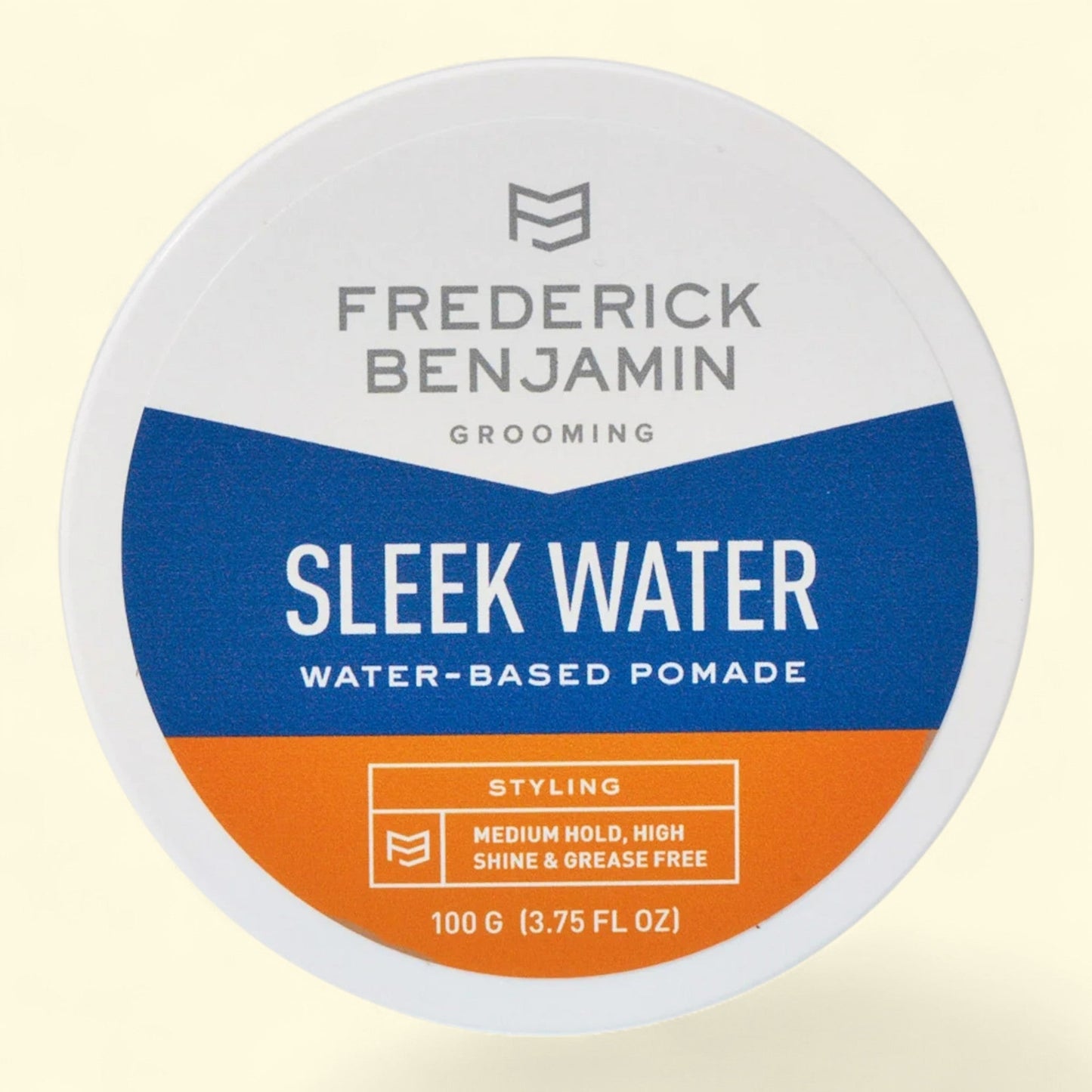 Frederick Benjamin Sleek Water water-based pomade container on a beige background