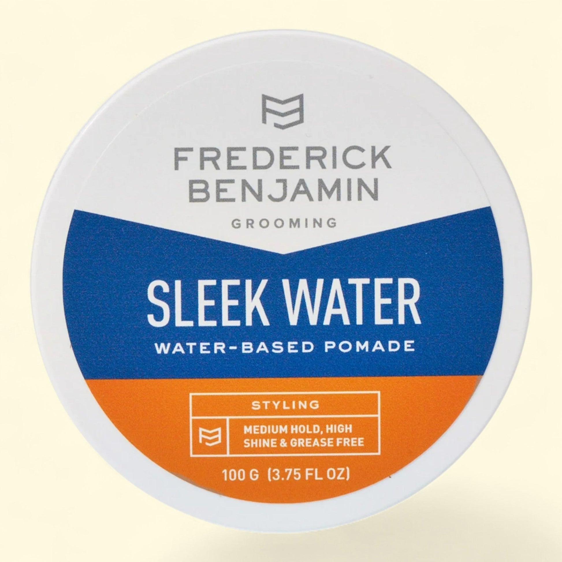 Frederick Benjamin Sleek Water water-based pomade container on a beige background