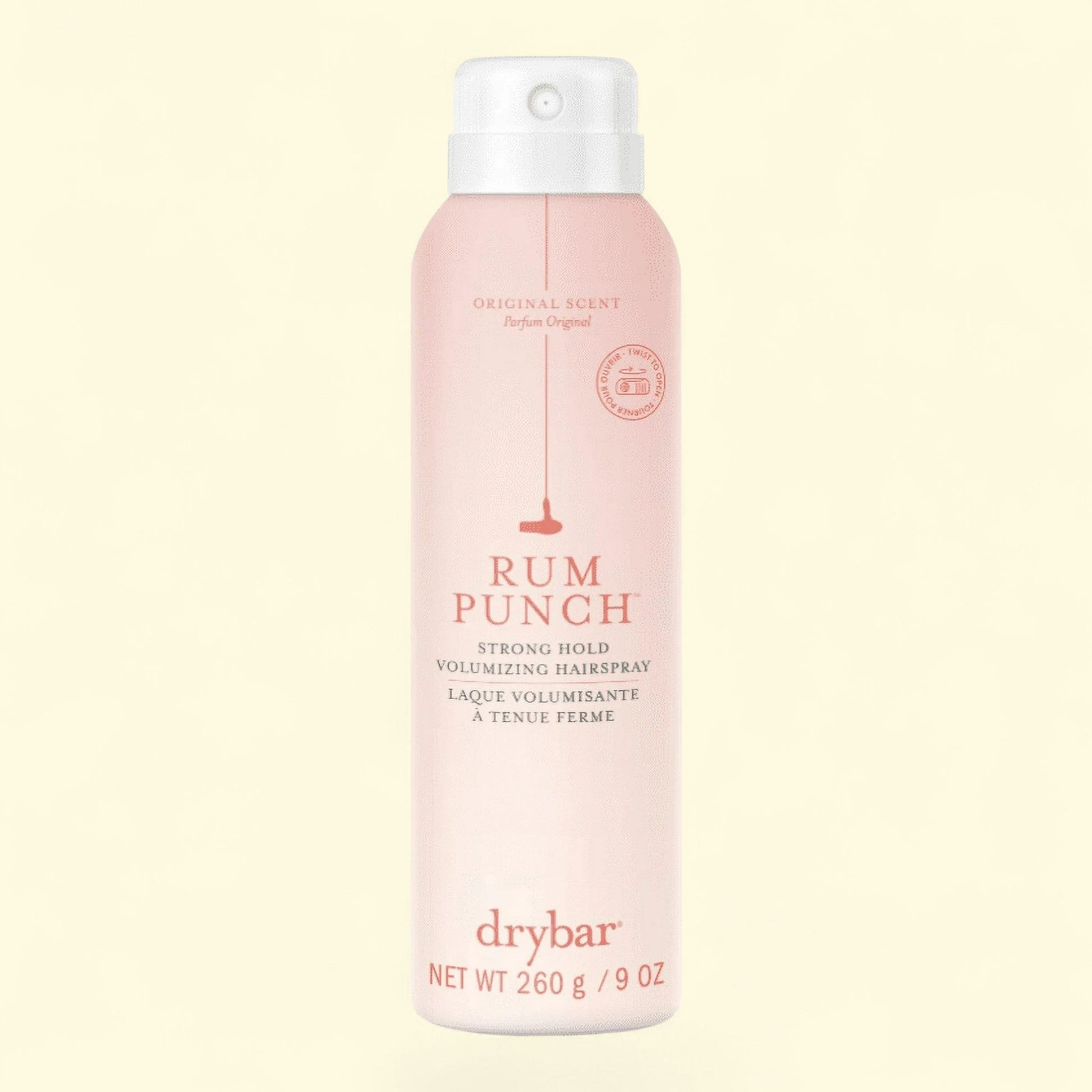 Drybar Rum Punch hair spray bottle on a light pink background