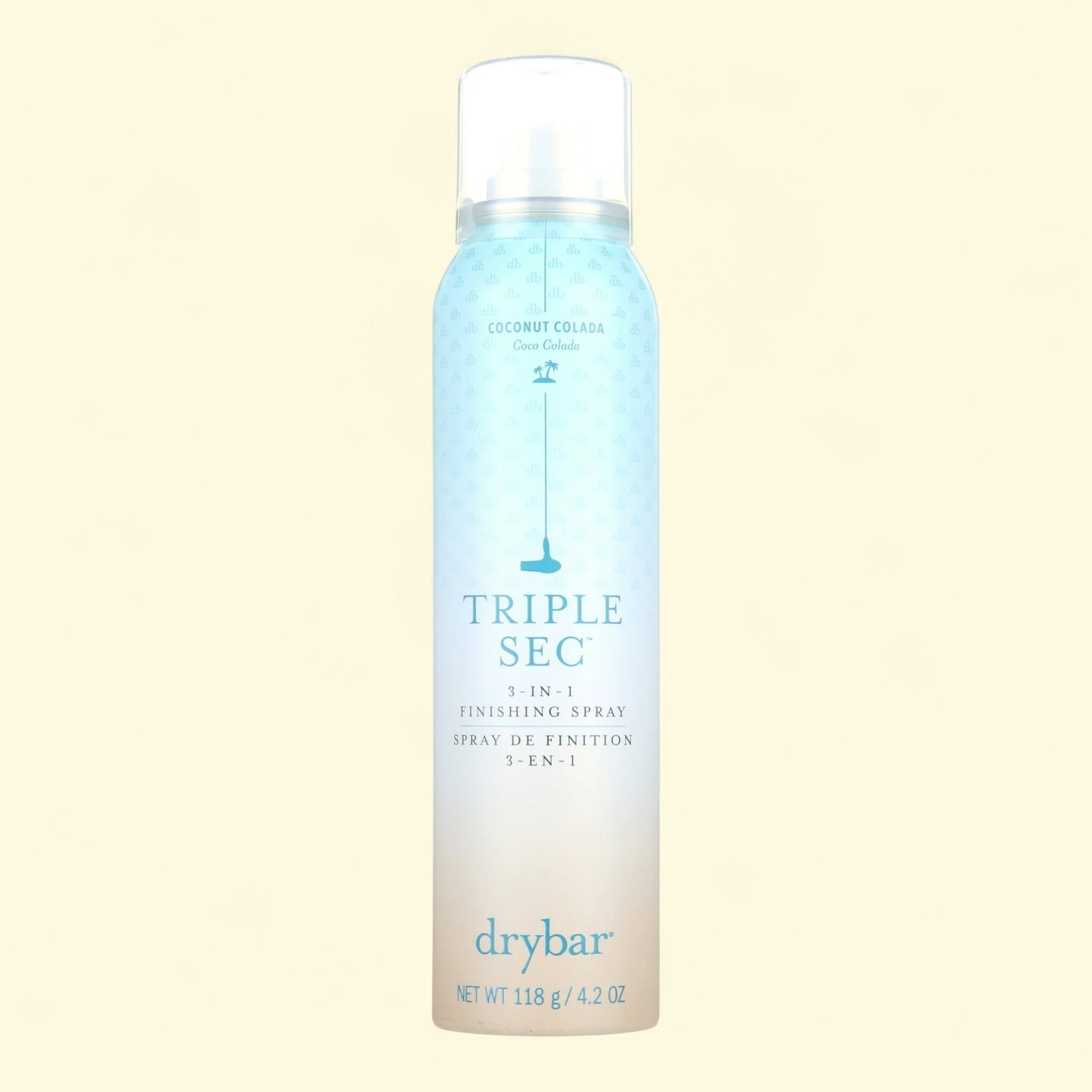 Drybar Triple Sec 3-in-1 Finishing Spray bottle on a light beige background