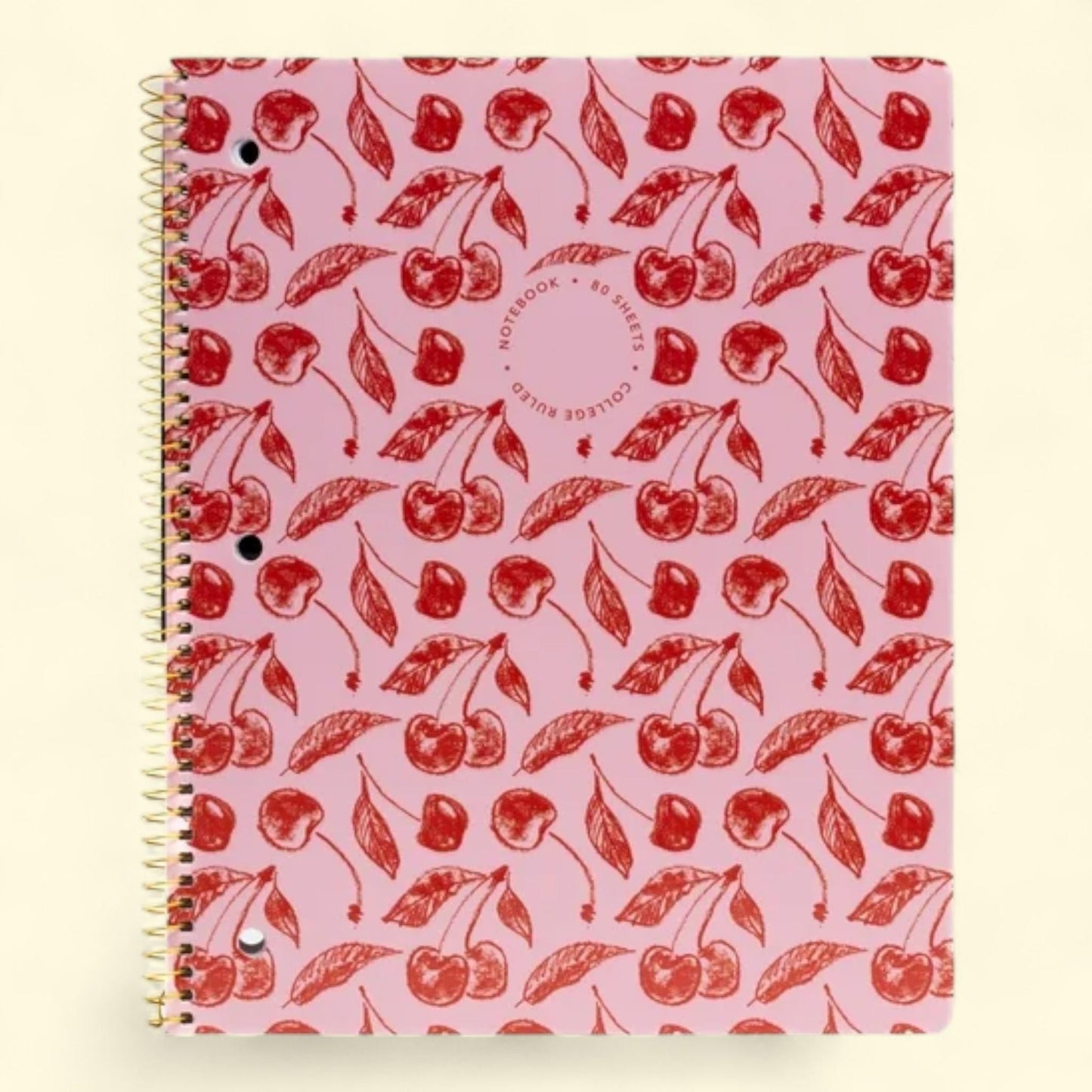 Notebook with red cherry pattern on a pink background