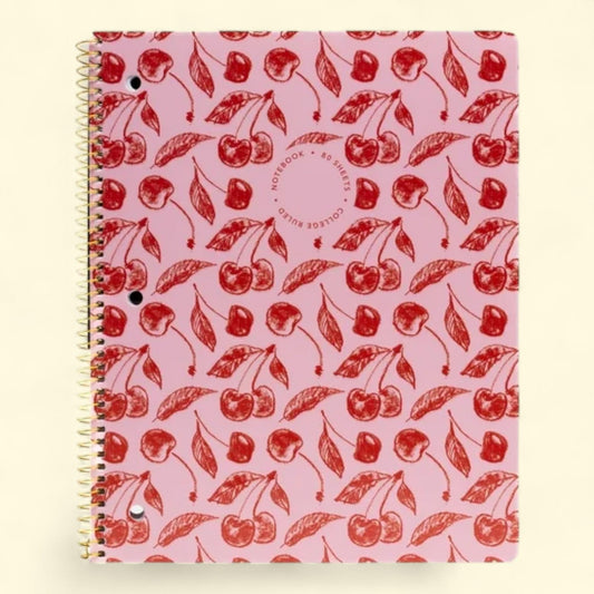 Notebook with red cherry pattern on a pink background