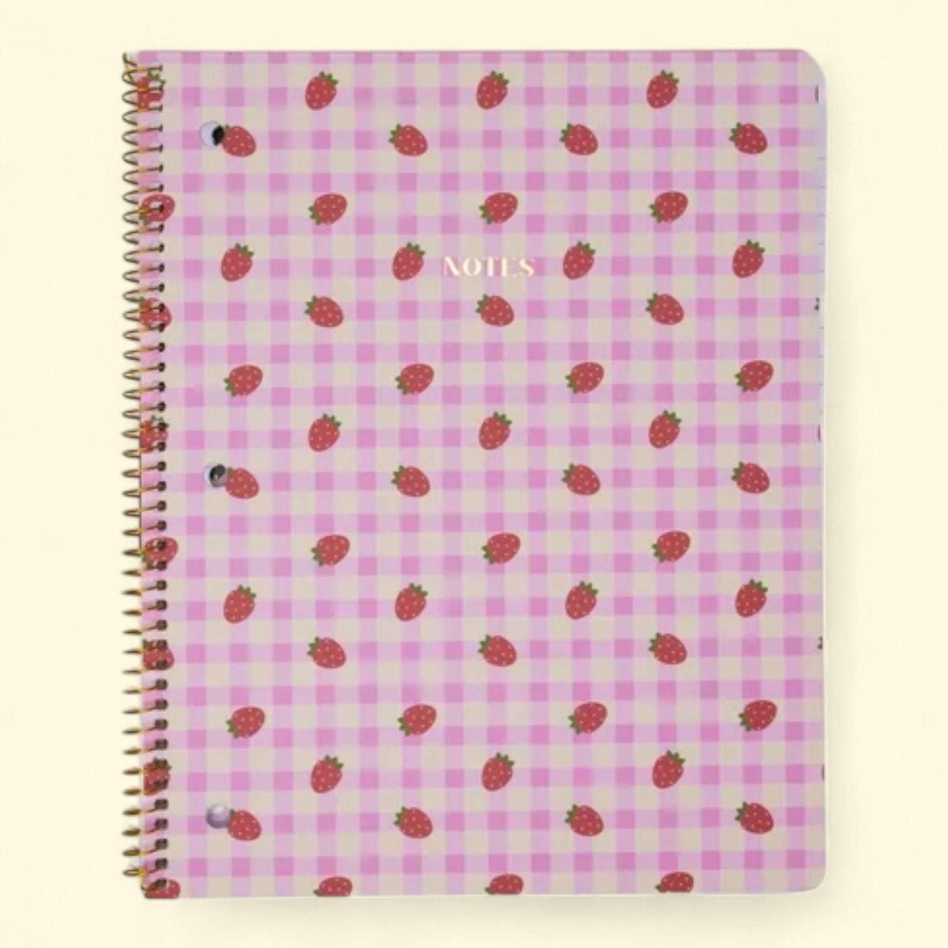 Notebook with strawberry pattern on a pink and white checkered background