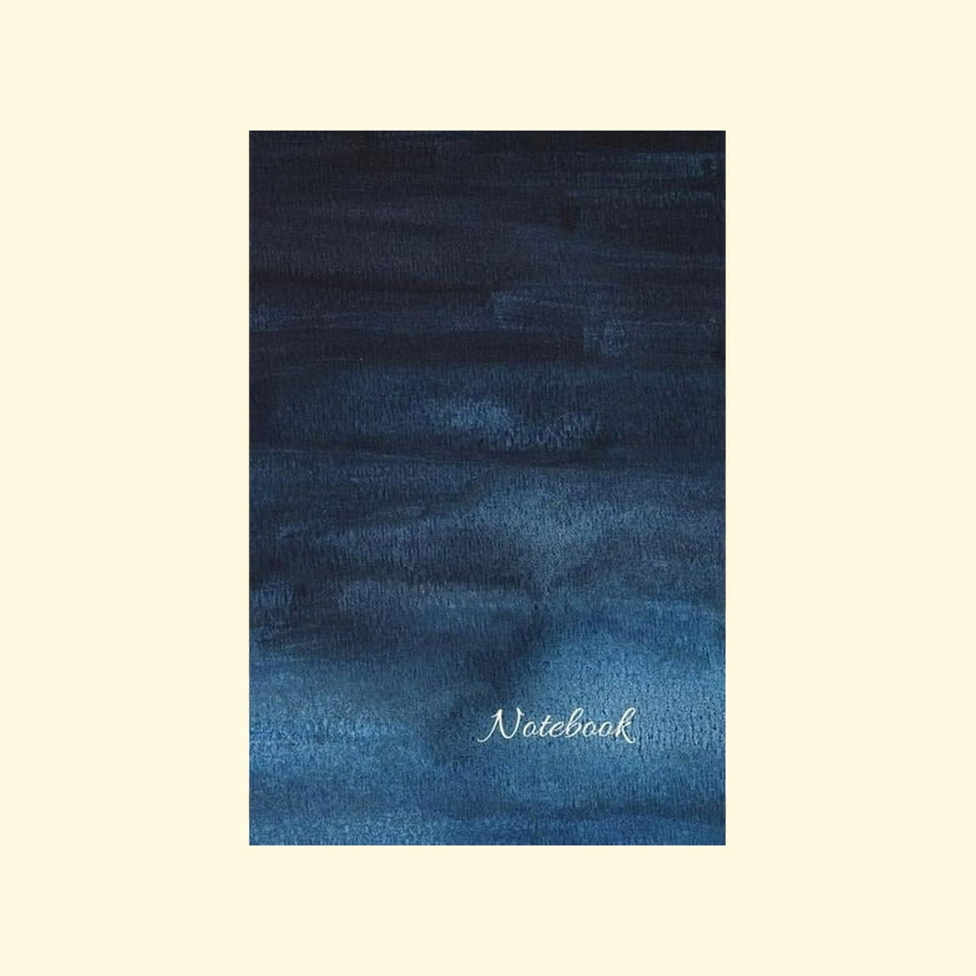 Blue textured notebook cover with 'Notebook' text on a beige background
