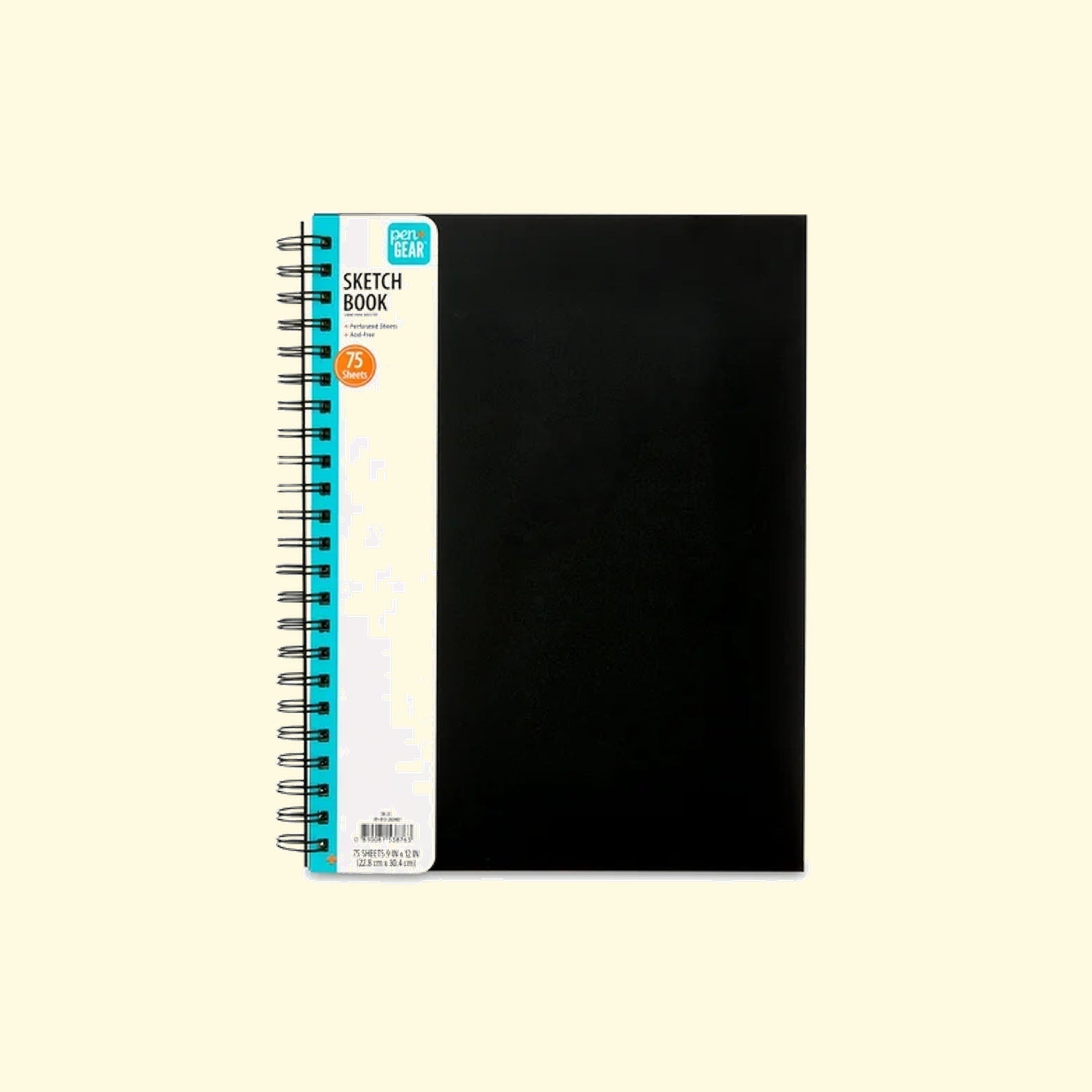 Black sketchbook with a white spine on a beige background