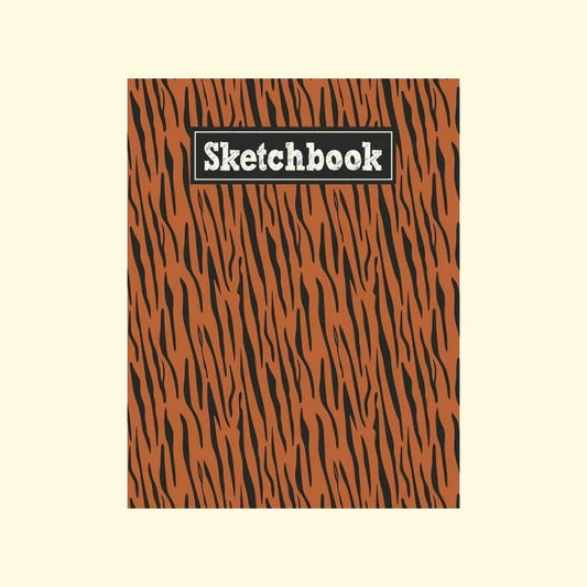 Sketchbook with orange and black zebra pattern on a beige background