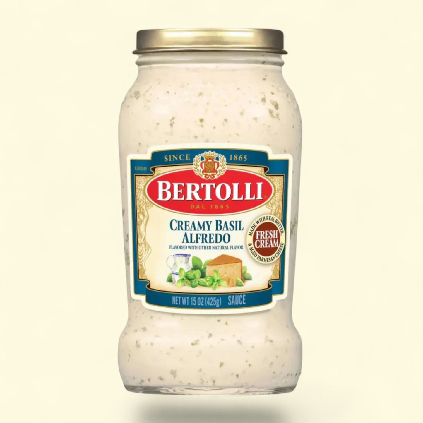 Bertolli Creamy Basil Alfredo sauce jar on a beige background