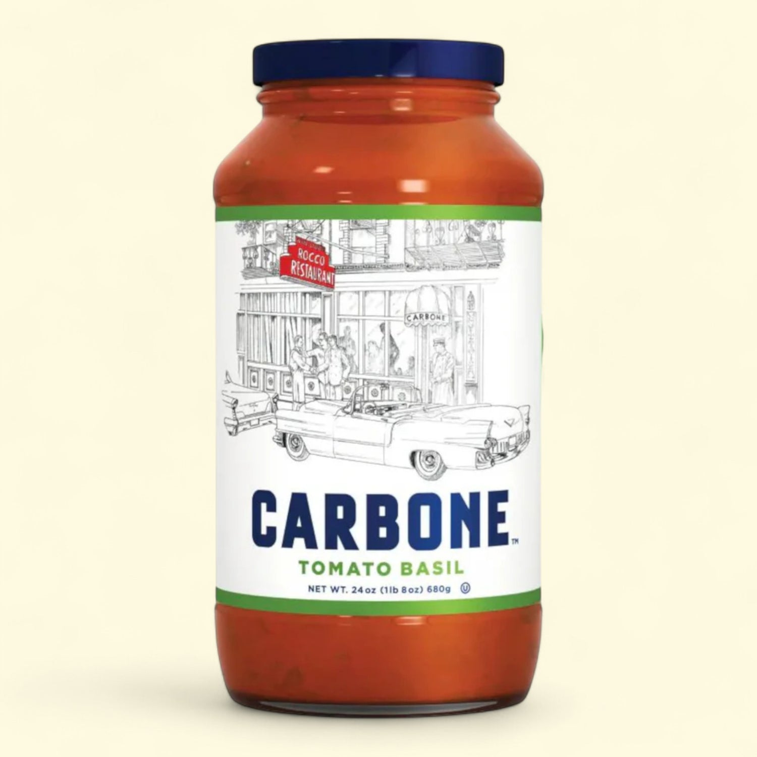 Jar of Carbone Tomato Basil pasta sauce on a beige background