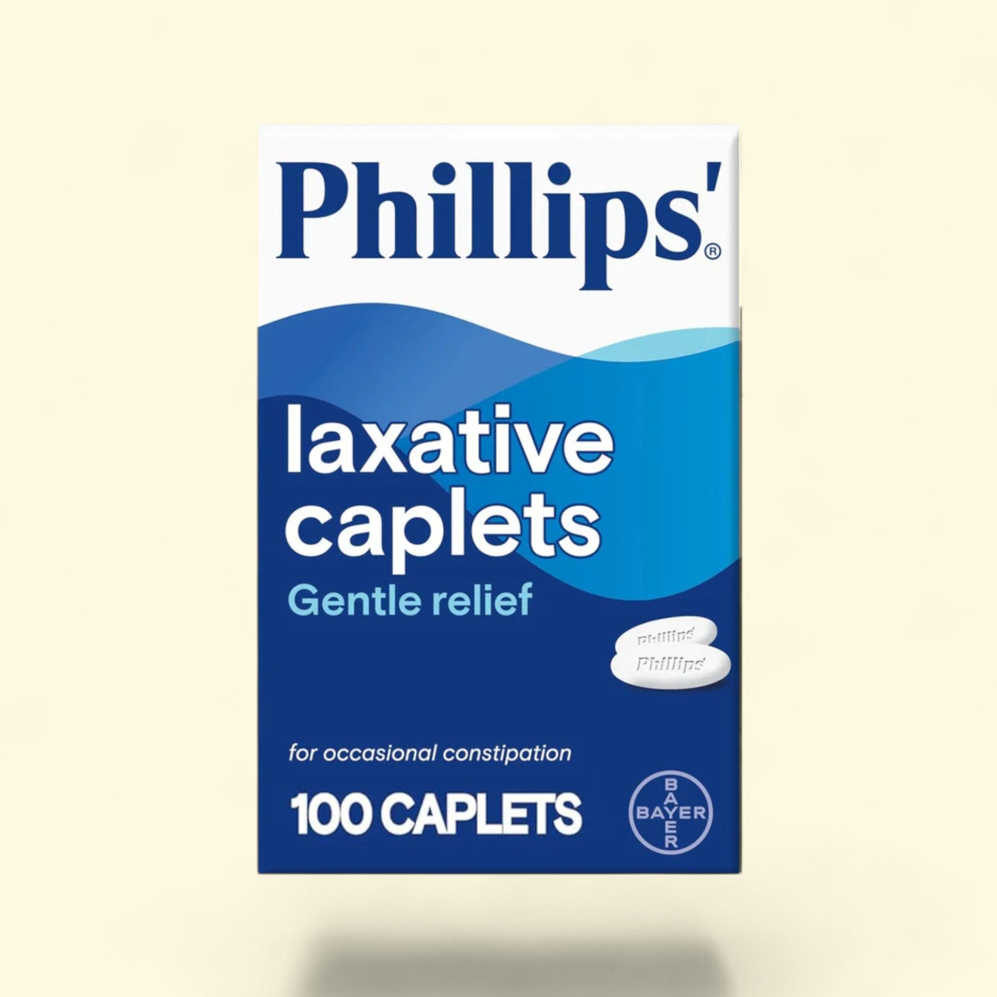 Box of Phillips' laxative caplets on a beige background
