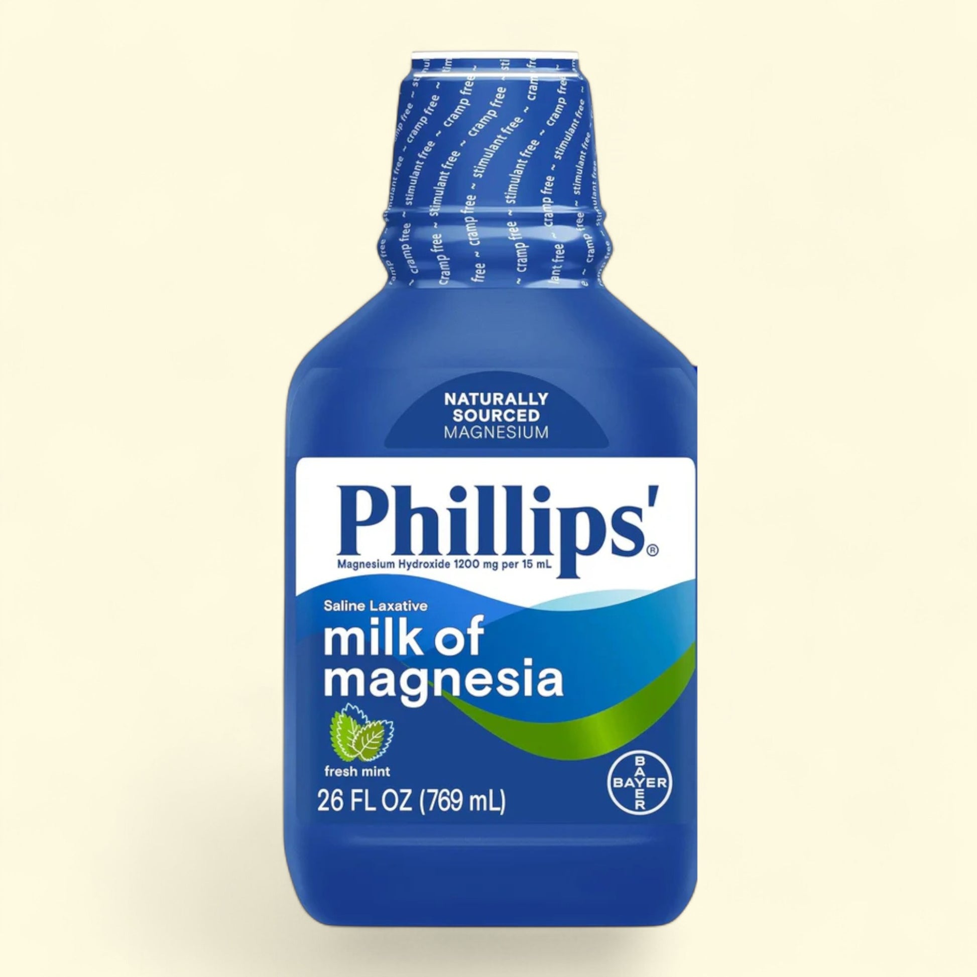 Blue bottle of Phillips' Milk of Magnesia on a beige background