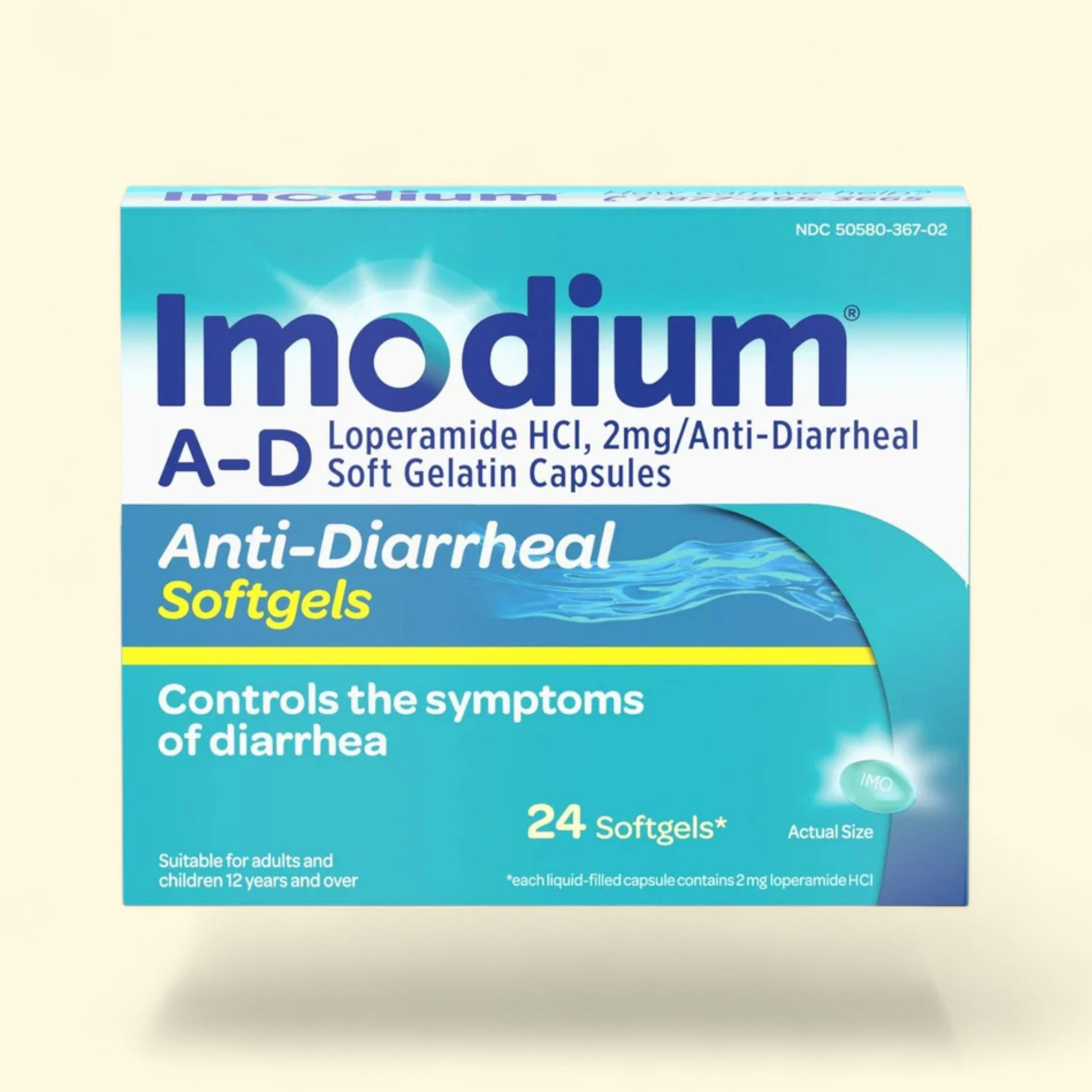 Imodium A-D anti-diarrheal softgels packaging on a beige background
