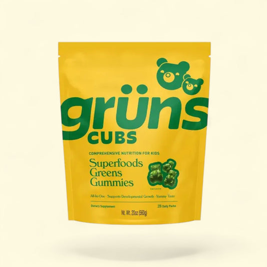 Yellow package of grüns Cubs Superfoods Greens Gummies on a beige background