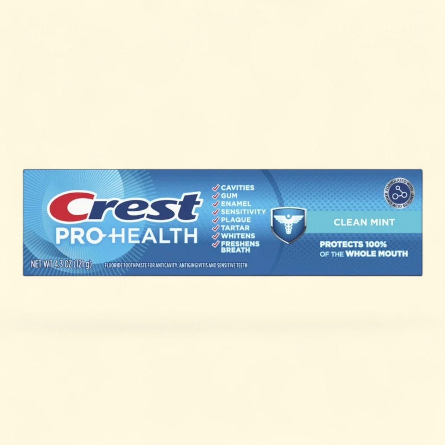 Crest Pro-Health toothpaste tube on a beige background