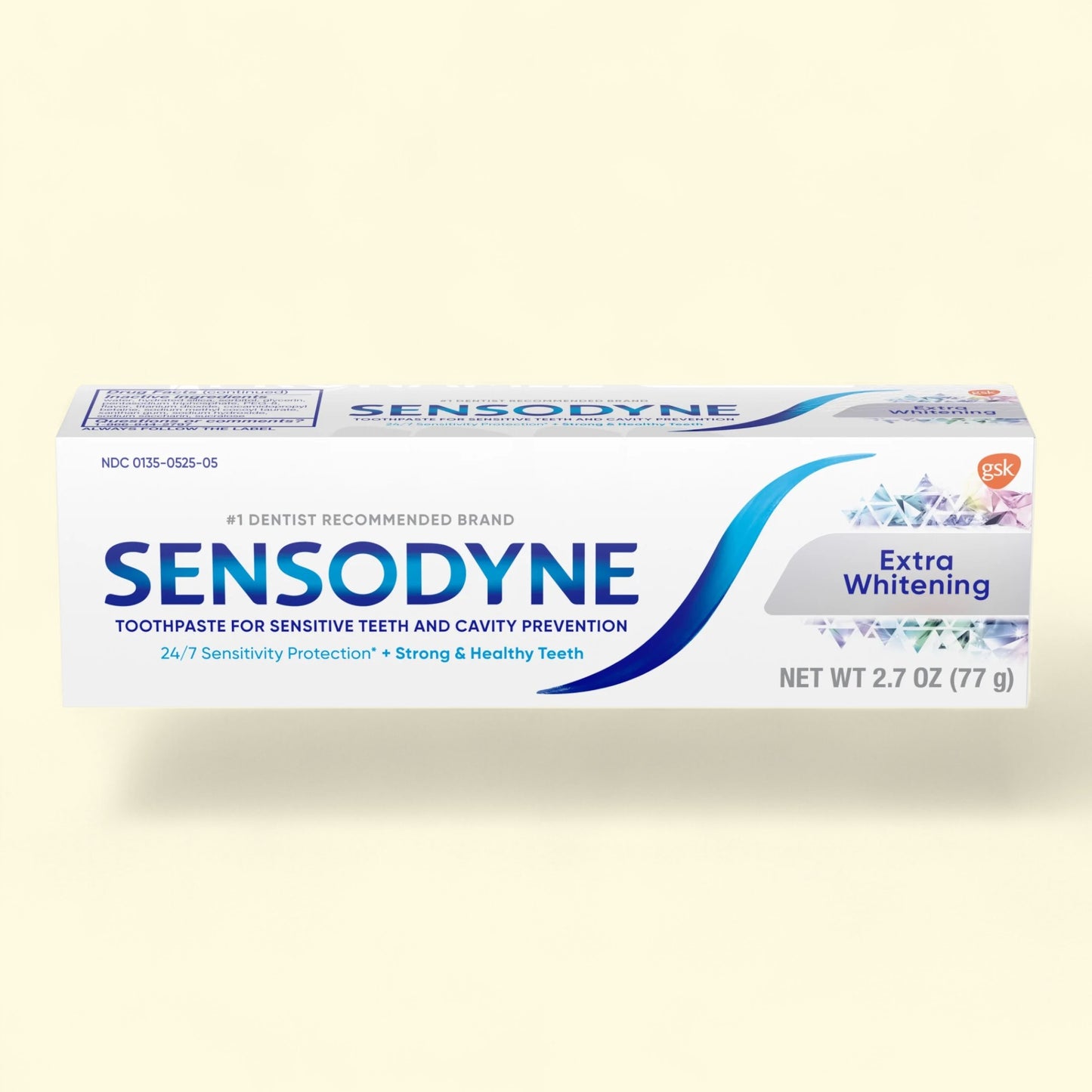 Sensodyne Extra Whitening toothpaste tube on a light beige background