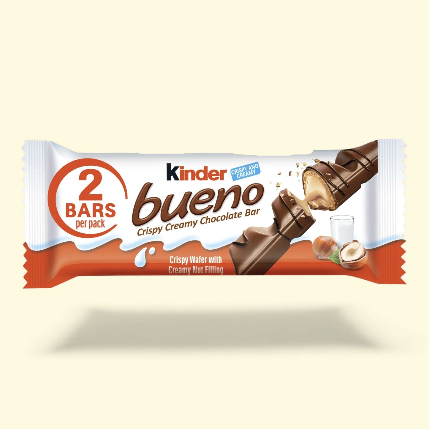 Kinder Bueno chocolate bar packaging on a beige background