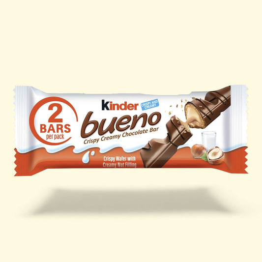 Kinder Bueno chocolate bar packaging on a beige background