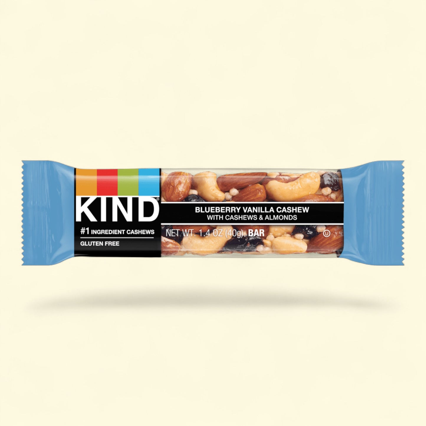 Kind Blueberry Vanilla Cashew bar on a beige background