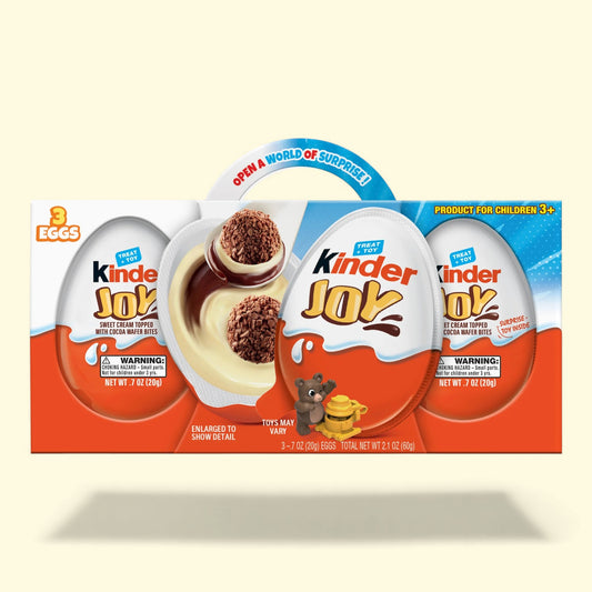 Kindergarten Joy chocolate egg packaging on a beige background