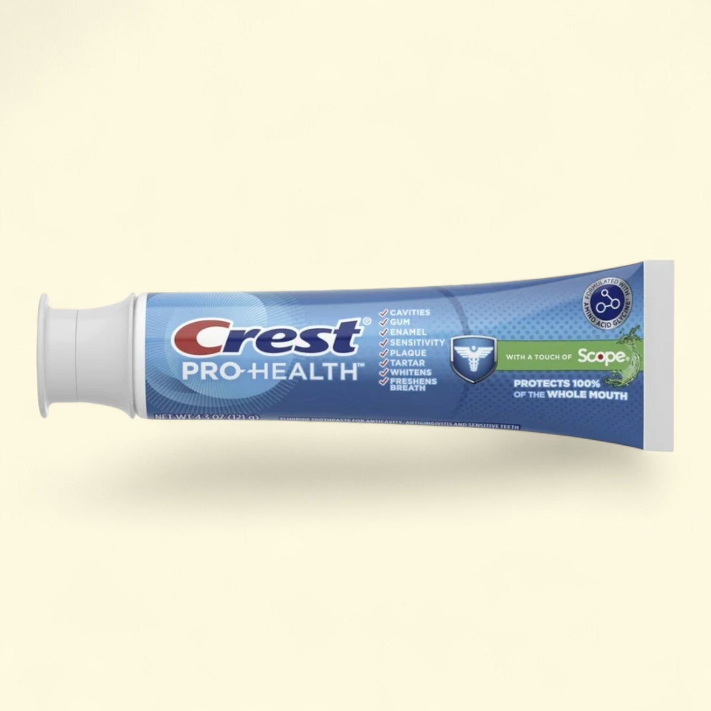 Crest Pro-Health toothpaste tube on a beige background