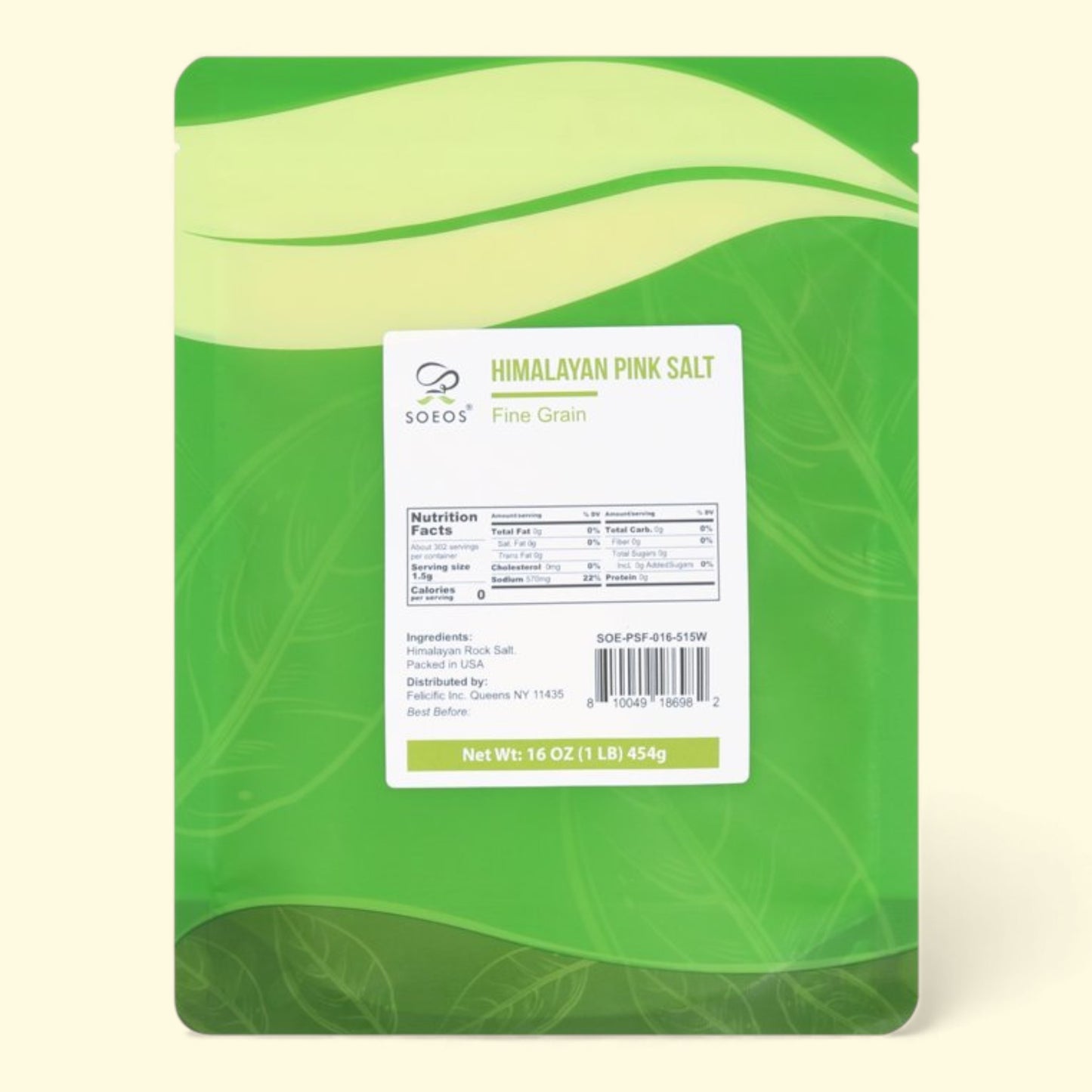 Green package of Himalayan pink salt with a label on a beige background
