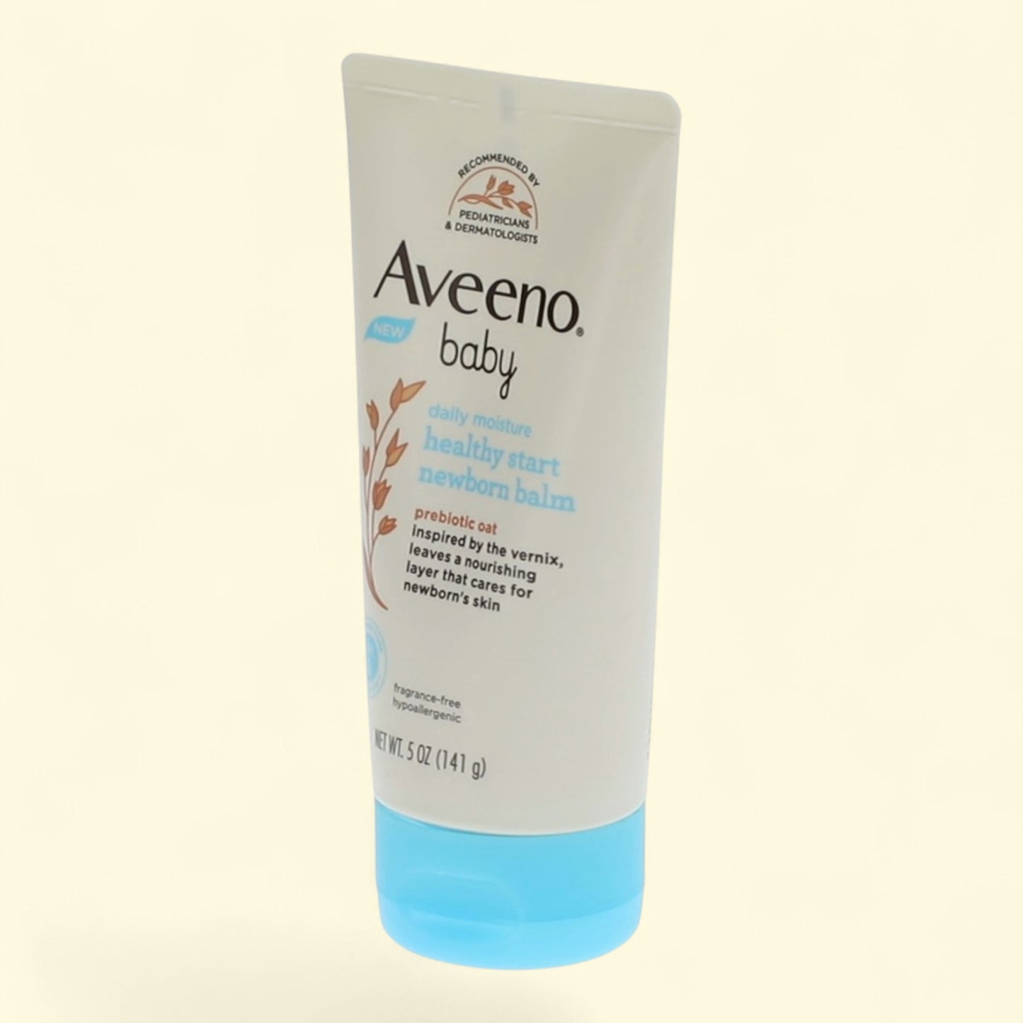 Aveeno baby lotion tube on a light beige background