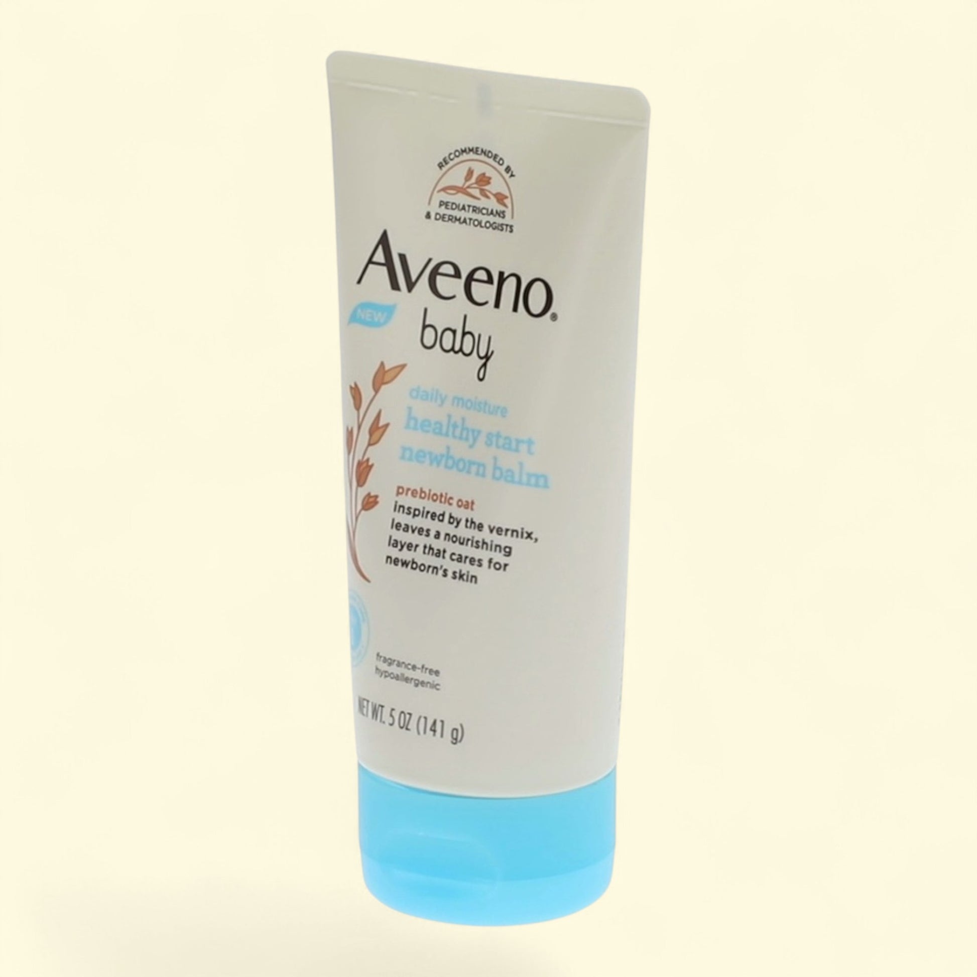 Aveeno baby lotion tube on a light beige background