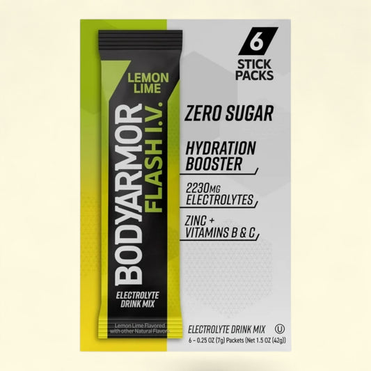 BodyArmor Flash I.V. Lemon Lime hydration booster stick pack on a light yellow background