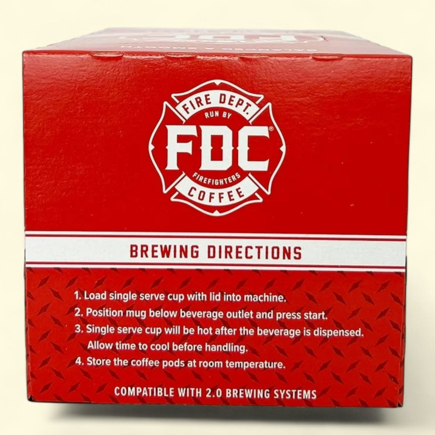 Red box of Fire Department Coffee with brewing directions on a beige background