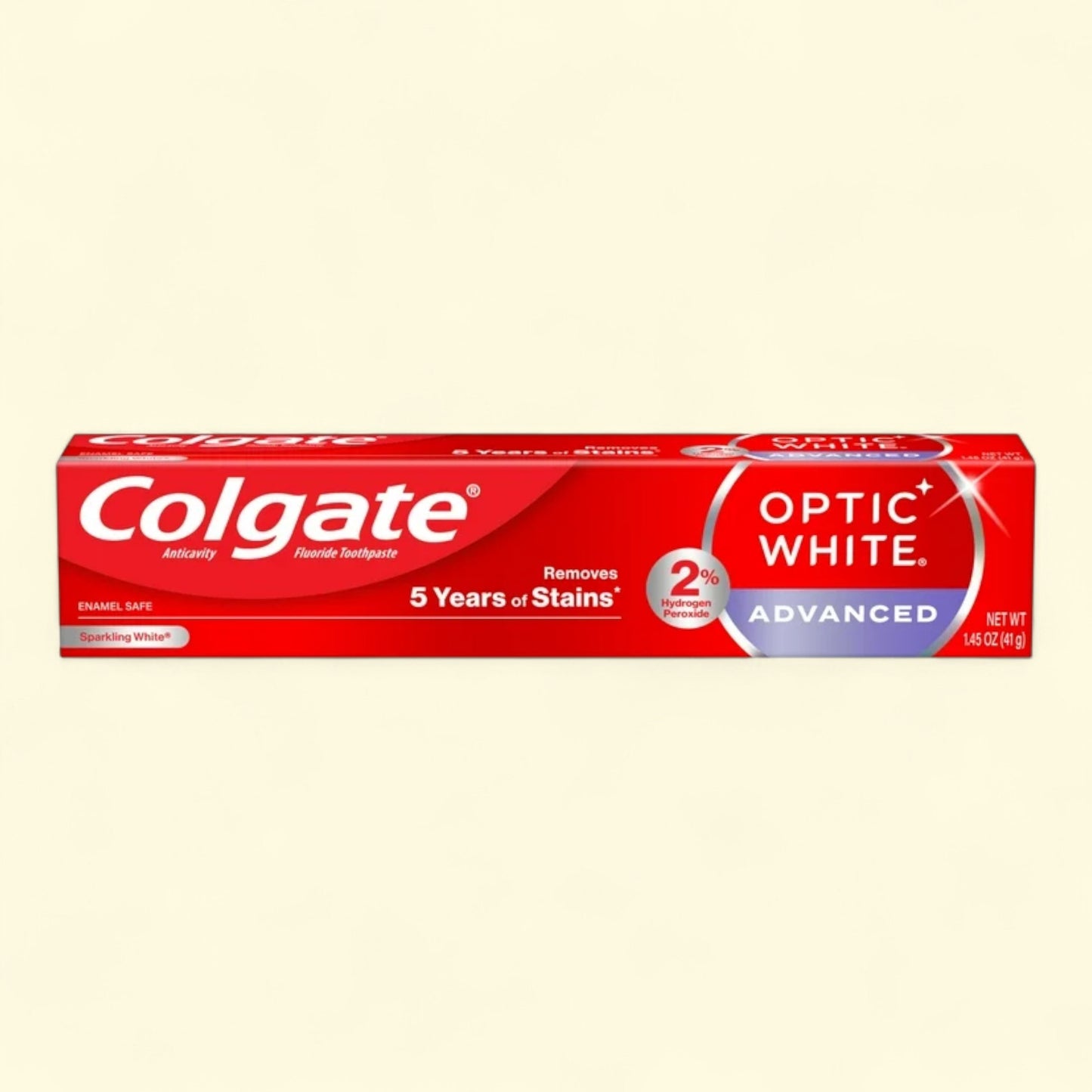 Colgate Optic White Advanced toothpaste tube on a beige background