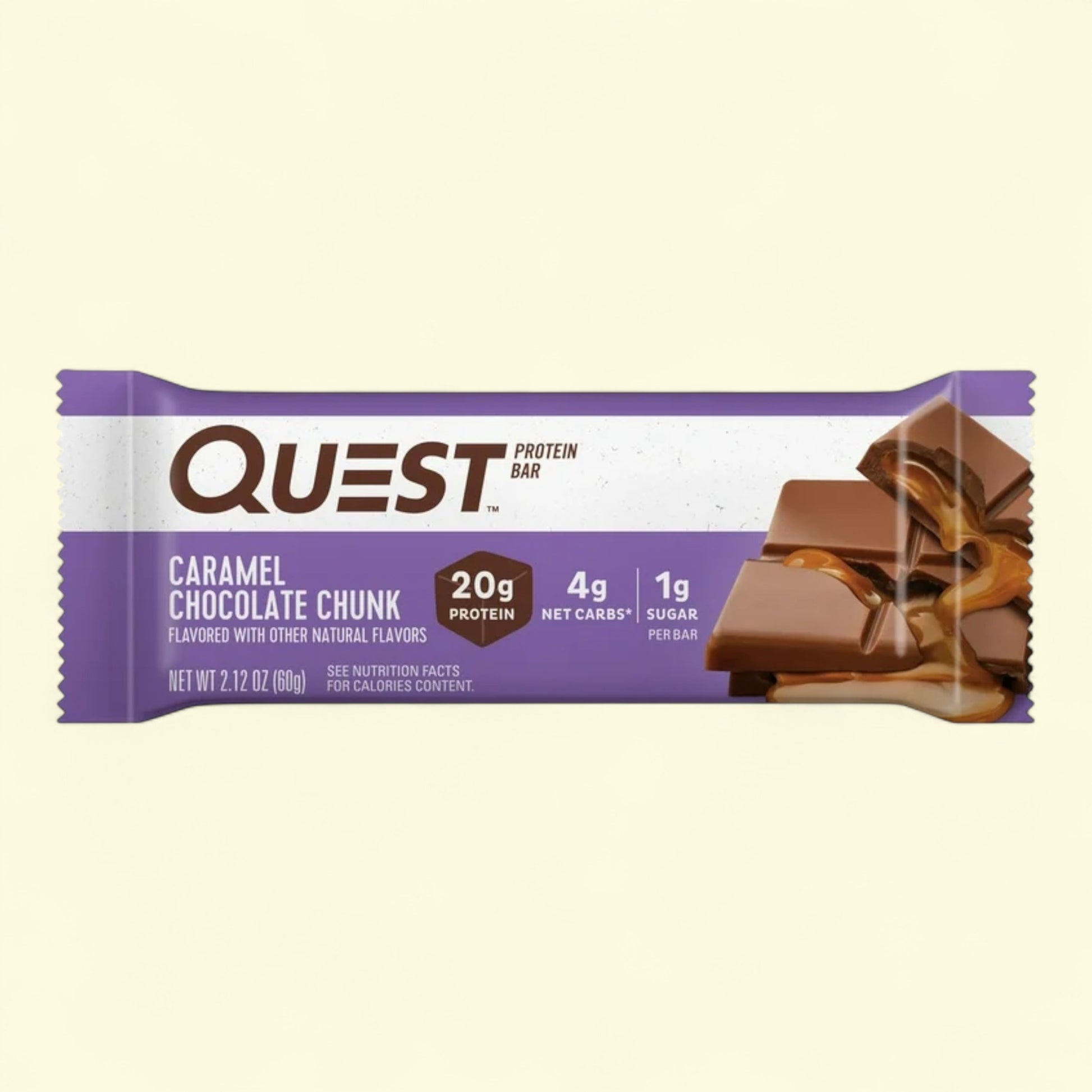 Quest protein bar caramel chocolate chunk flavor packaging with on a beige background
