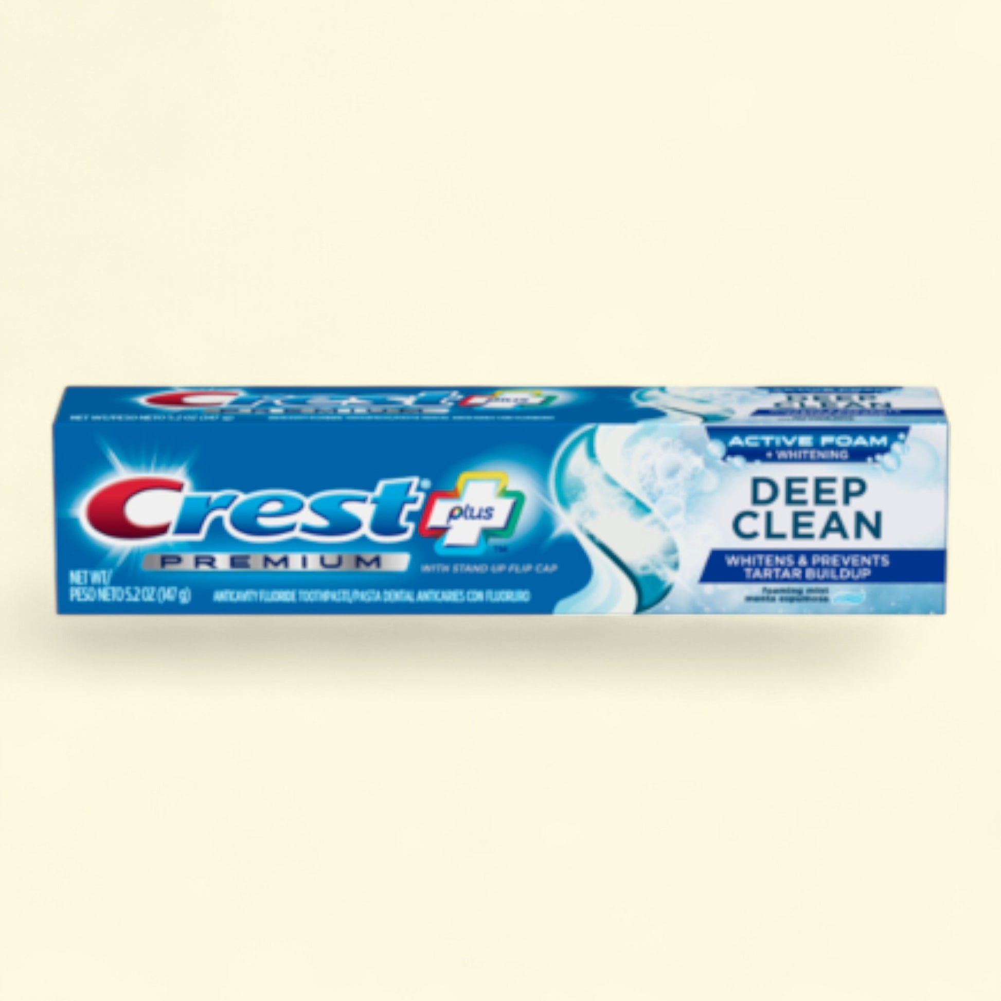 Crest Deep Clean toothpaste tube on a beige background