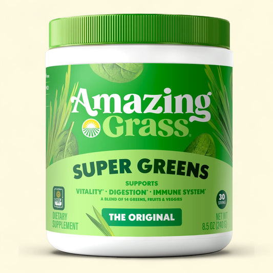 Container of Amazing Grass Super Greens supplement on a beige background