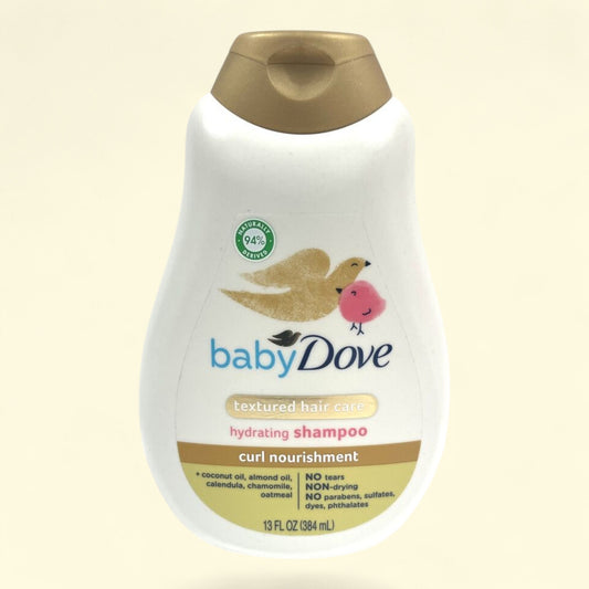 Baby Dove shampoo bottle on a beige background