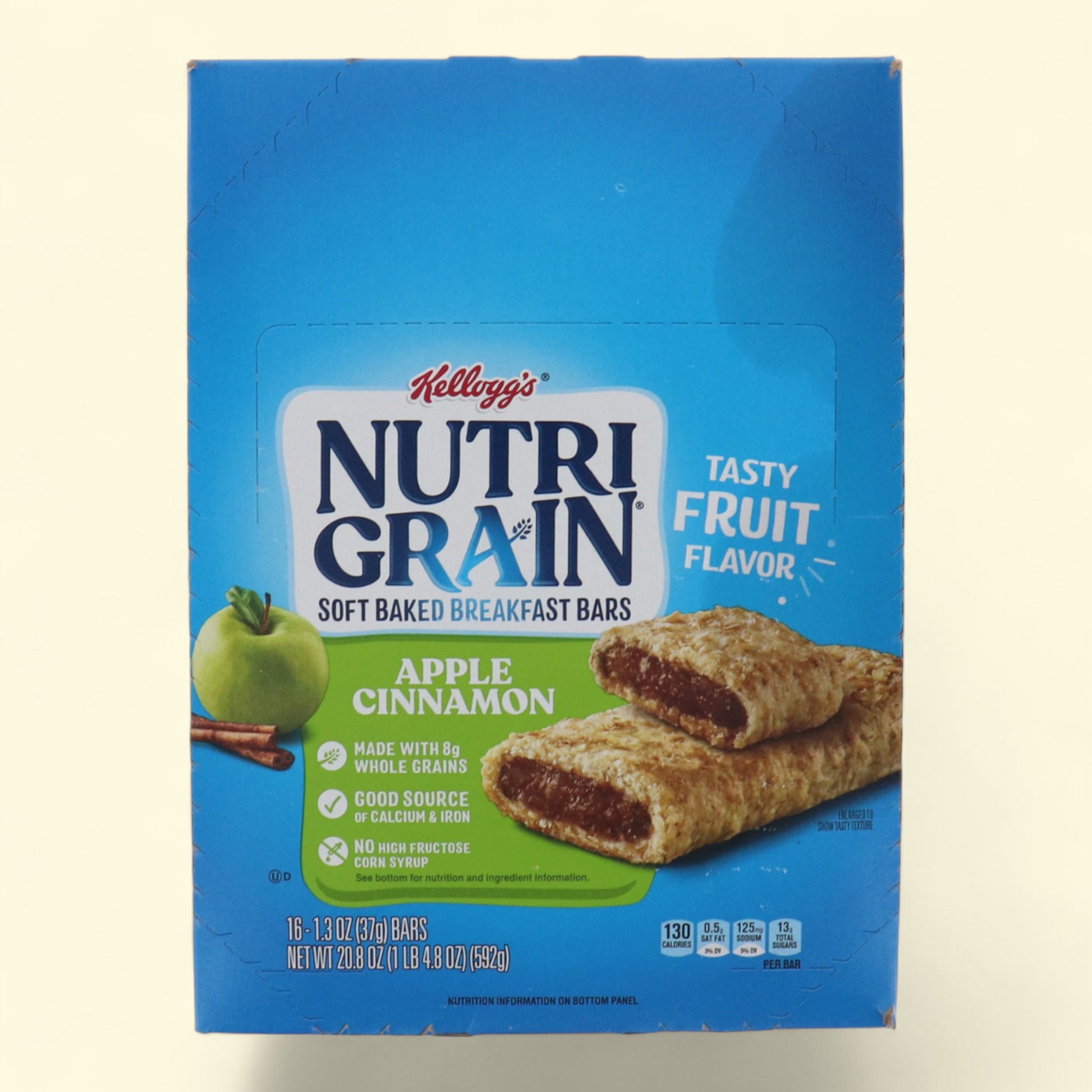 Box of Kellogg's Nutri-Grain Apple Cinnamon breakfast bars on a beige background
