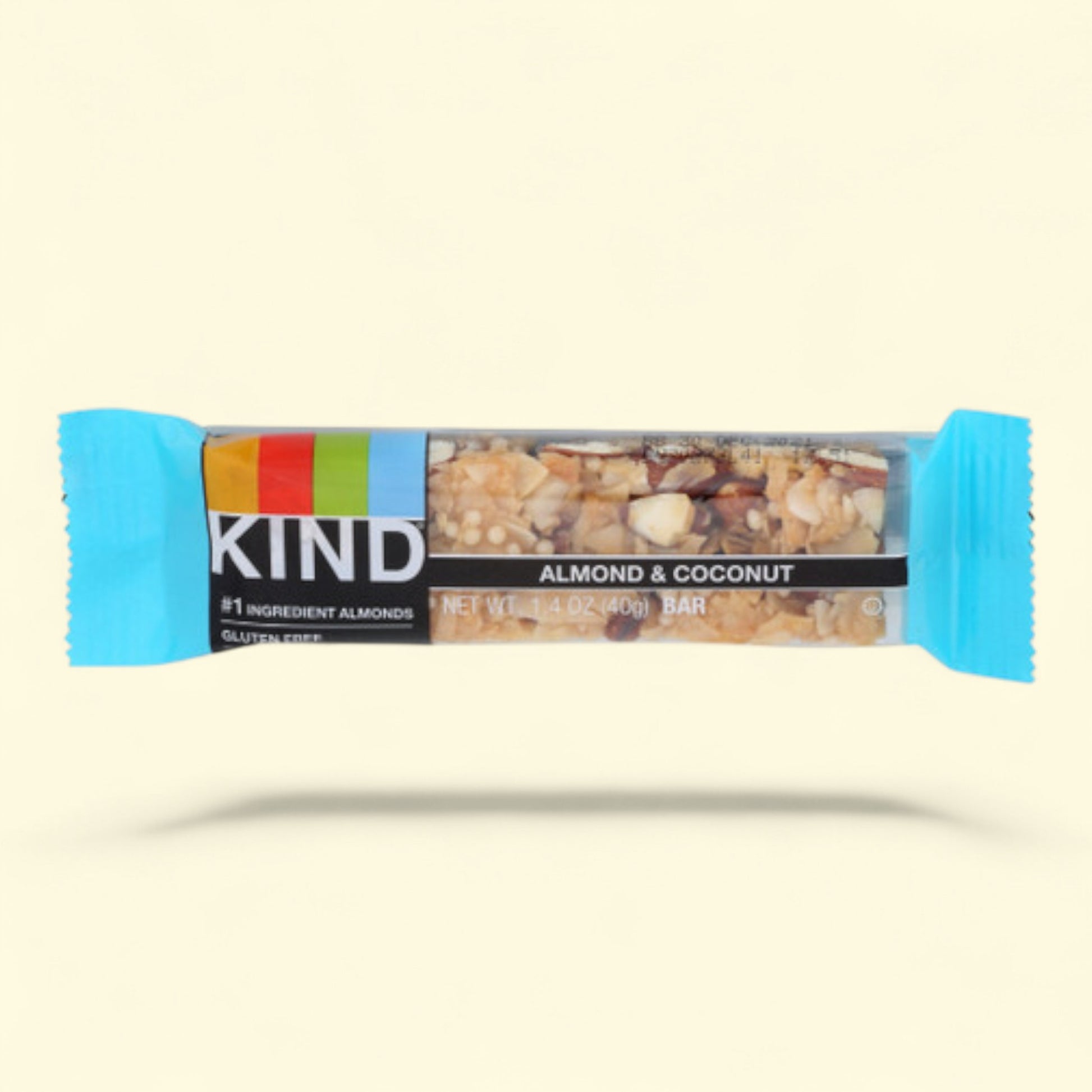 Kind almond and coconut bar on a beige background