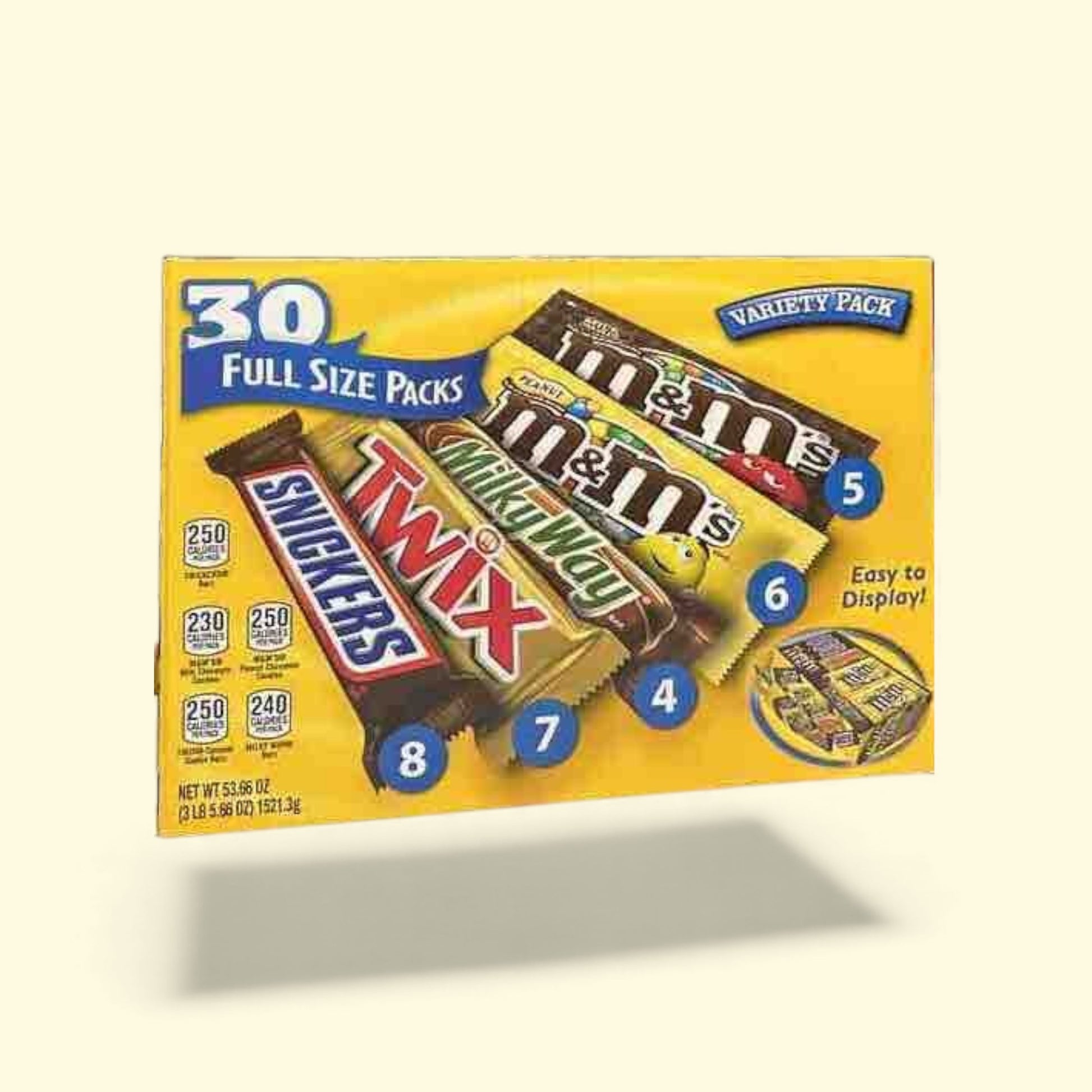 Box of candy bars including M&M's, Snickers, Twix, and Milky Way on a beige 