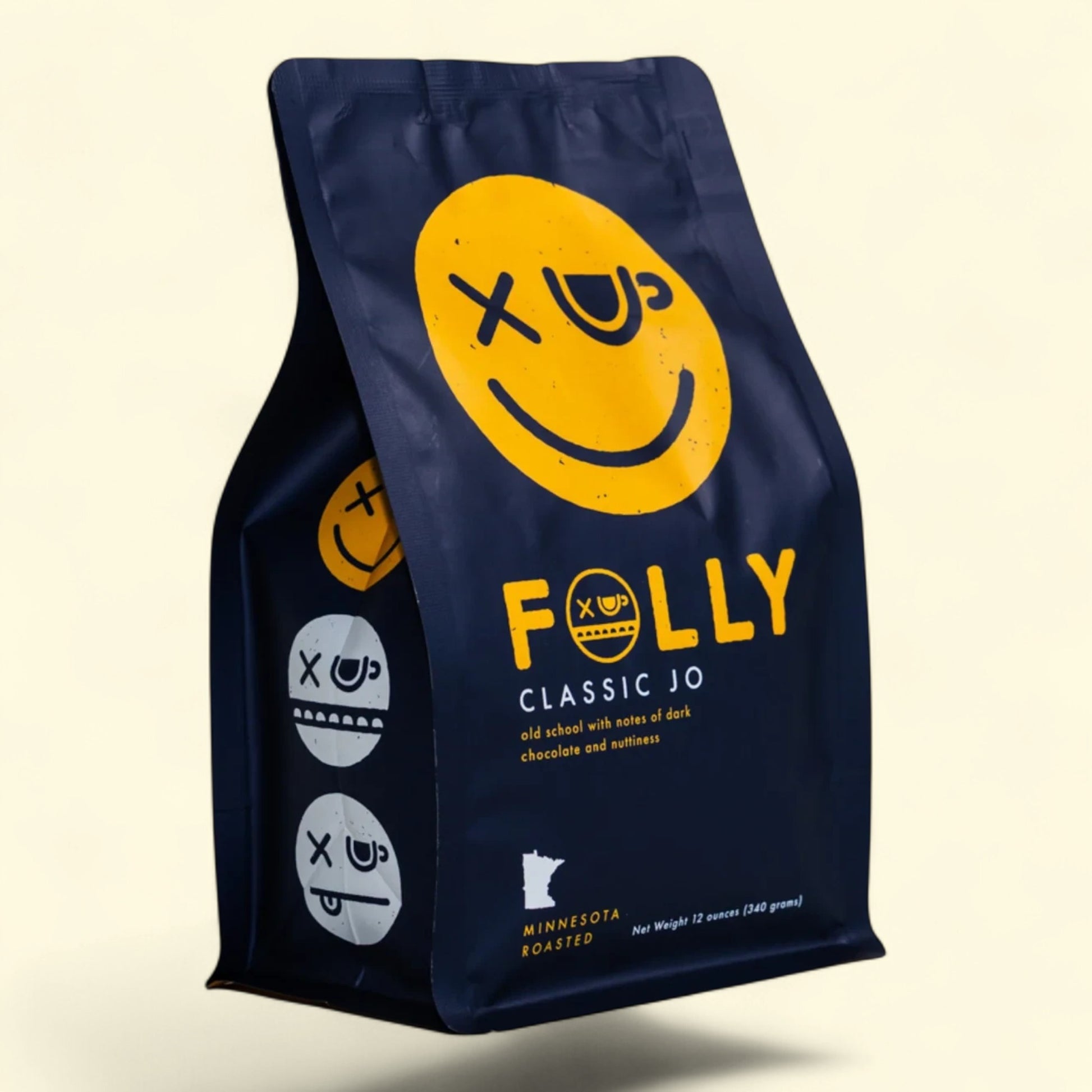 Treatspree Folly Coffee Classic Jo whole bean medium roast coffee bag with yellow smiley face logo and dark blue packaging.