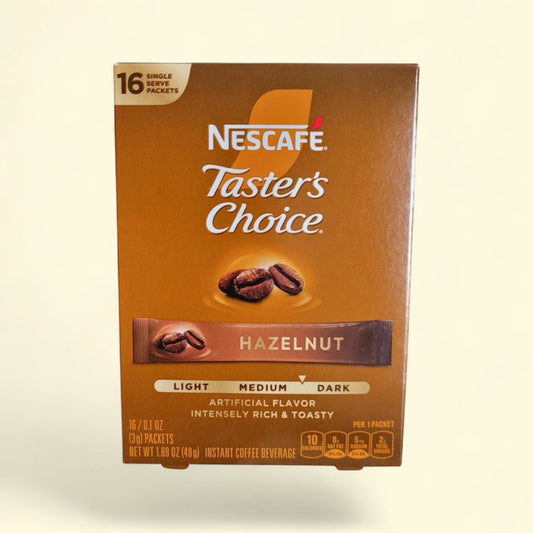 Treatspree NESCAFÉ Taster's Choice Hazelnut Flavored Instant Coffee, 16 single-serve packets. Medium-dark roast with artificial hazelnut flavor.