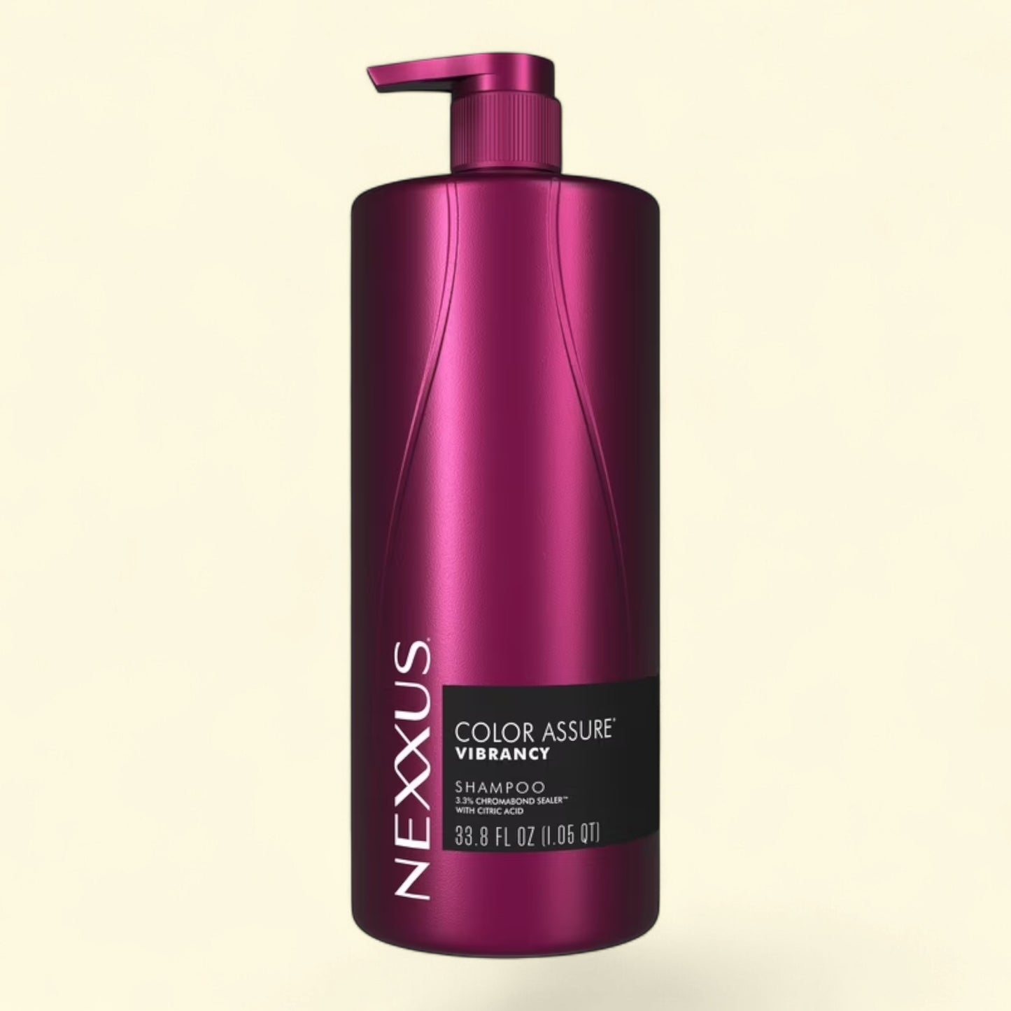 Treatspree Nexxus Color Assure Vibrancy shampoo bottle with pump dispenser, 33.8 oz, in metallic magenta.