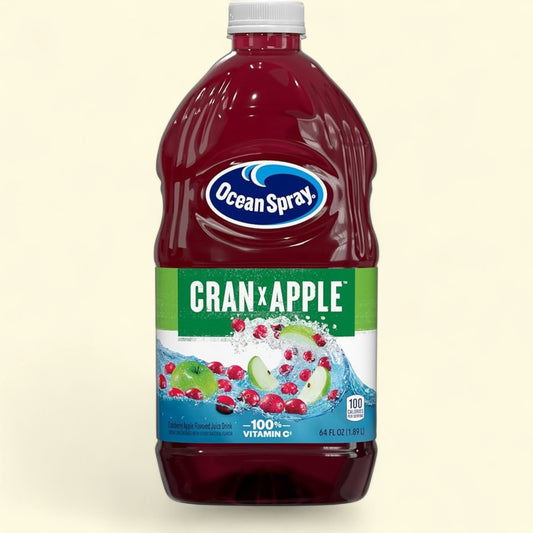 Treatspree Ocean Spray Cran-Apple juice drink in a 64 fl oz bottle. Features whole cranberries and apple slices with splashing water.