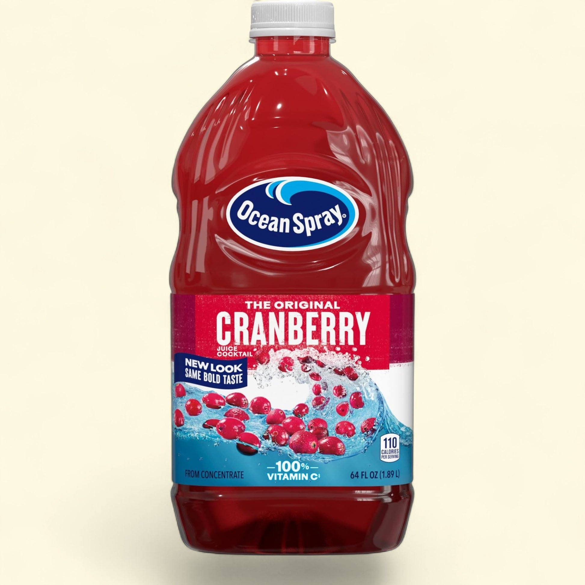 Treatspree Ocean Spray The Original Cranberry Juice Cocktail, 64 fl oz bottle with white cap. Rich red liquid with whole cranberries and water splash graphic.