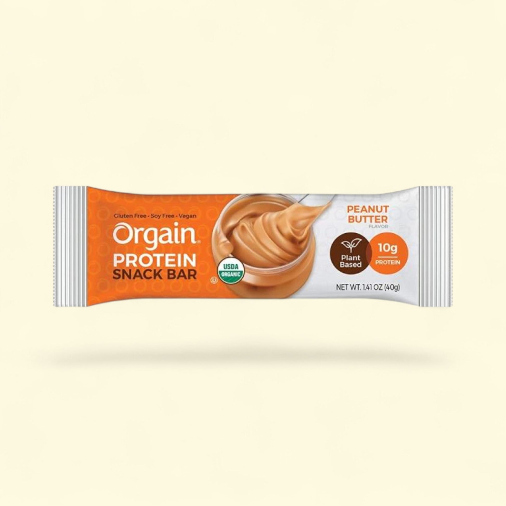 Orgain Peanut Butter protein snack bar packaging on a beige background