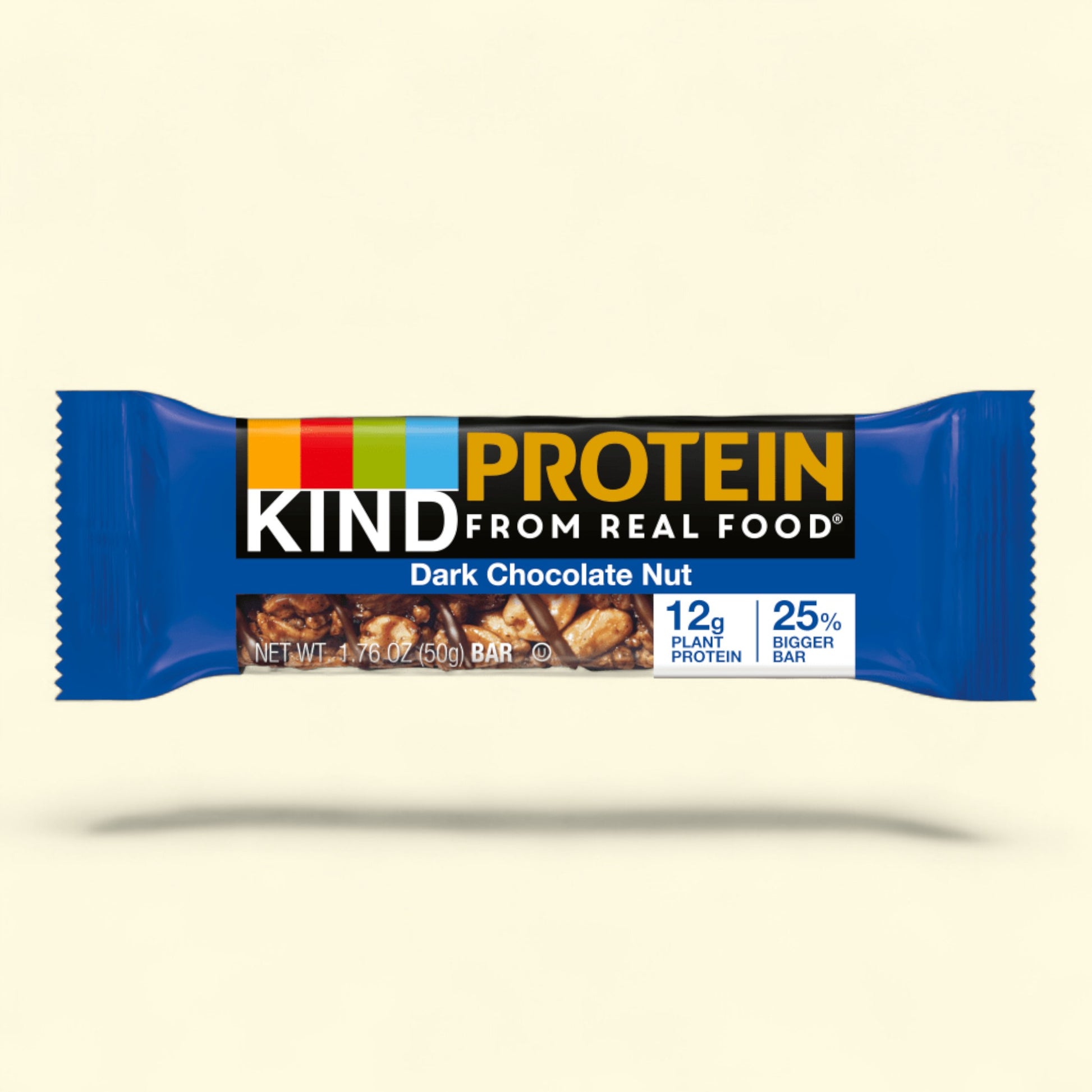 Kind Protein from real food Dark Chocolate Nut bar on a beige background