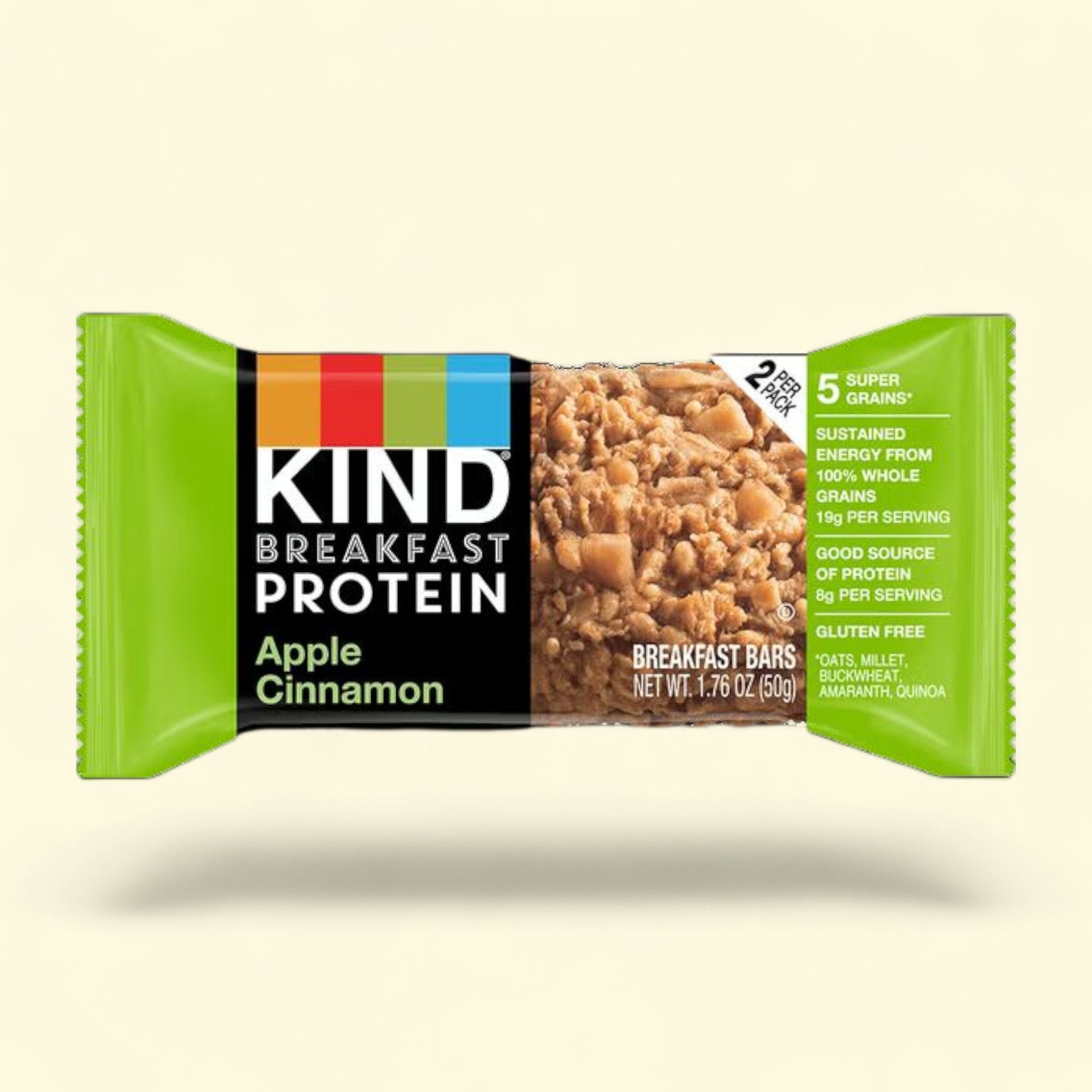 Kind Apple Cinnamon breakfast protein bar packaging on a light beige background